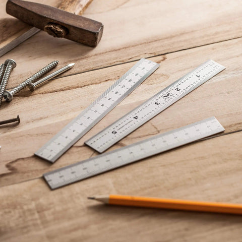 Pro Grade Machinist Ruler Set, 6 Inch Stainless Steel With Metric And Imperial Markings on a wooden surface with tools