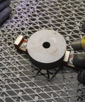 Alnico 5 Bridge Magnet With Keeper For Guitar Pickups, Red Cast Finish, round top view on metal surface