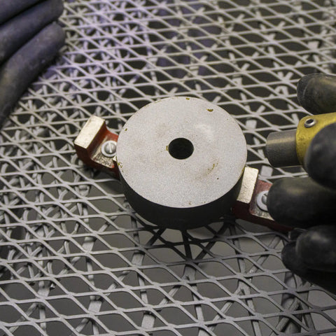 Alnico 5 Bridge Magnet With Keeper For Guitar Pickups, Red Cast Finish, round top view on metal surface