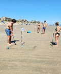 Family playing with Beach Side Golf Set For The Sand With Two Adjustable Putters Waterproof Dry Bag Flags Cups on beach