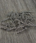 Close-up of stainless steel coil springs for Cherry MX/Gateron MX keyboard switches; 110-pack replacement springs.