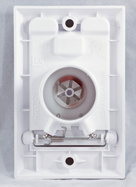 Hayden white central vacuum wall inlet interior view; circular hose port and spring latch visible.