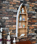 Wooden Boat Shelf With Three Shelves For Beachy Nautical Decor against brick wall with coastal figurines, 32 Inch Long