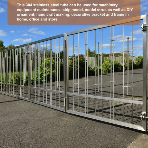Stainless steel gate with vertical tubes, outdoor fencing panel.