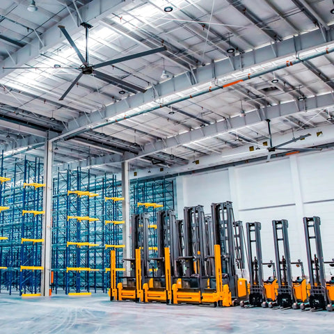 Heavy Duty 18Ft Hvls Industrial Ceiling Fan serving up slick air flow to warehouses and factories, with forklifts below.
