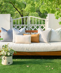 Outdoor bench with assorted cushion covers and a flower basket, showcasing Pack of 4 Outdoor Pillow Covers 18x18 Inches Blue.