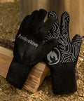 High Heat Grill Gloves For Cooking And BBQ on logs, universal fit, non slip grip, heat resistant up to 450F, black kitchen gloves