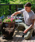 Man using MINA Alkaline Water Filter 3 Pack For At Home Pitcher to water plants on a patio, demonstrating easy use and functionality.