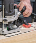 Kick Your Sign Making Routine With This Slick Clear Plastic Routing Template Set Packing Vintage Vogue Block Numbers Scaled Just Right For Dead On Precision On Every Router Job Today. Close-up of plunge router in use on wooden surface.