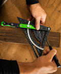 Precision Aluminum 7 Inch Rafter Square With Locking Pivot Arm And Angle Finder Featuring Three Level Vials in use on wood.
