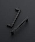 Two handles from 25 Pack Solid 4 Inch Center To Center Slim Square Bar Drawer Handles In Matte Black Cabinet Hardware For Kitchen Cabinets