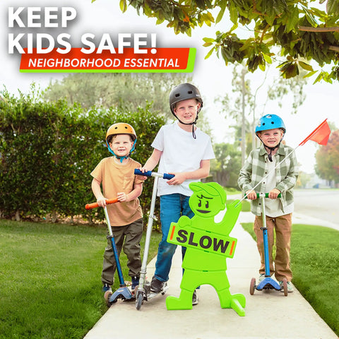 Kids at Play Safety Sign with high-visibility flag on sidewalk with children on scooters for traffic slow down zone
