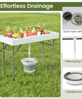 Portable Folding Ice Cooler Table With Drain And Satin Skirt Matching Foldable Bucket Bev Station For Parties Picnics And Camping Four Foot Party Ready Ice Table showcasing drainage system with bucket