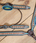 Western Horse Headstall And Breast Collar Tack Set Crafted From Genuine Argentina Cowhide Leather With Geometric Tooling white rhinestones and turquoise details on wood background.