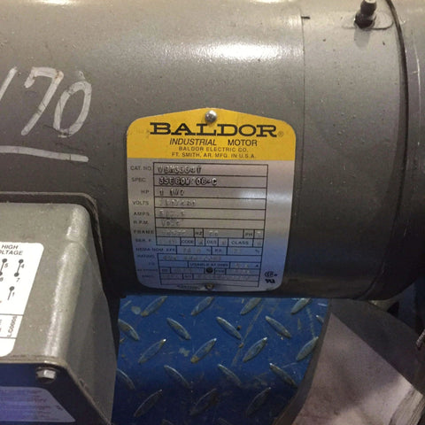 Close-up of a Baldor brake motor label showing VBM3554T model, 1.50 HP, 1800 RPM, 208-230/460V three-phase TEFC industrial motor