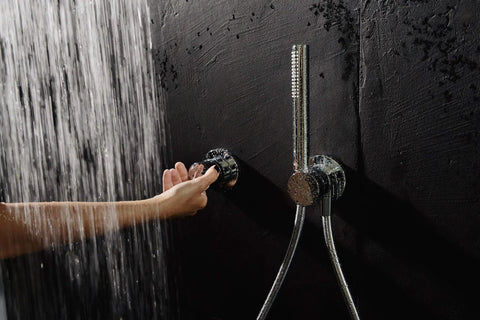 Sleek Recessed Shower System With Thermostatic Control And Anti Scald Safety Lock Chrome Plated Finish integrated diverter valve and handheld sprayer in use.