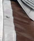 Close-up of 12 Ft By 40 Ft Tough As Nails Heavy Duty Waterproof Tarp with D Rings showing reversible white and brown surfaces.