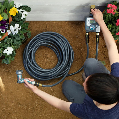 Person connecting a garden hose with Two Piece Brass Garden Hose Quick Connect Fittings Set For Hoses Nozzles And Sprinklers.