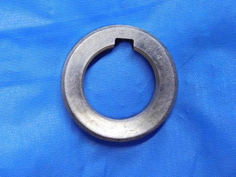 Top Shelf Bulk Lot Of Eight Precision Milling Machine Arbor Spacers For Your Shop Rig One Inch To One Nine Sixteenths Inside Diameter, steel spacer viewed from above.