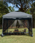10x10 Pop Up Canopy Tent With Screen Walls, Waterproof Portable Shade For Camping in a park setting, chairs inside