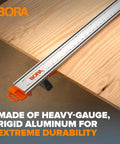 Close-up of NGX 96 Inch Clamp Edge System With Quick Connect And Quick Lock Lever on plywood showing aluminum durability.