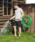 Man using Freestanding Garden Hose Reel Stand With Storage Basket And Two Hooks, Holds 150 Ft Of 5/8 Inch Hose For Patio, Yard And Lawn.