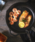 12 Inch Cast Iron Skillet With Lid Pre Seasoned Chef Pan For Indoor And Outdoor Cooking Even Heat Distribution Delivers Gourmet Seared Steaks Crispy Edges And Caramelized Veggies Campfire Ready Durable Safe Grill Cookware For Everyday Use featuring shrimp and fish with lemon