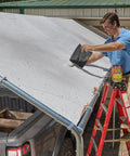 Man applying Heavy Duty Thick Rubberized Waterproof Tape For Patching Leaks And Sealing Cracks Indoors Or Outdoors Works Underwater Bonding