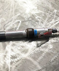 Zirconia Alumina Round Tip Portable Grinding Cone Type 16 Z20-S Pro Grade attached to grinder on metal surface