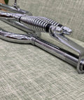 Close-up of 26 Inch Springer Fork For Cruiser Bicycles With Dual Spring Suspension, chrome finish, steel construction.