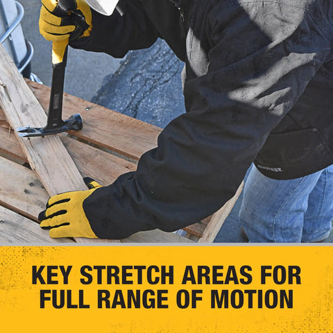 Person wearing Unisex Heated Heavy Duty Work Coat Without Battery Black Large Built For Cold Weather Water And Wind Resistant Duck Fabric With Durable Outer Layer Cozy Lined Interior Worksite Ready Tough As Nails For Construction And Outdoor Jobs Battery Not Included using a hammer on a wooden pallet
