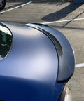 Real Molded Carbon Fiber Matte Dry Look Spoiler For Tesla Model 3 viewed from above showing sleek aerodynamic design.