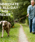 Man walking dog in park, showcasing comfort with All Day Comfort Men Insoles With Massaging Gel And Arch Support 1 Pair