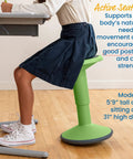 Child sitting on SitWell Wobble Stool With Adjustable Height For Active Seating In Classrooms And Libraries Grassy Green Boosts Posture
