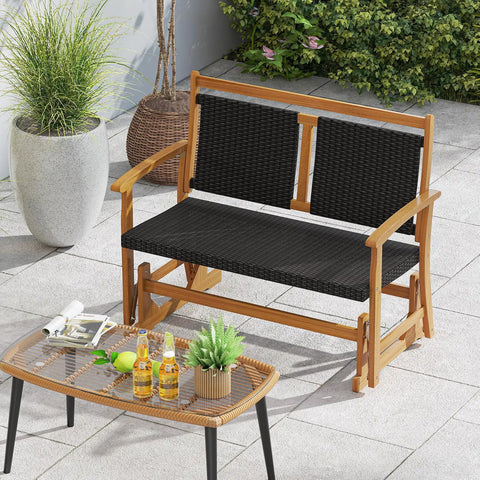 Two Person Wooden Outdoor Glider Bench With Acacia Wood Armrests And Wicker Back And Seat Rocking Patio Loveseat in patio setting