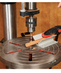 Top Notch Drill Press Table V Block Accessory Offers Sweet Support For Round Stock And Dowels bolted to a drill press table.
