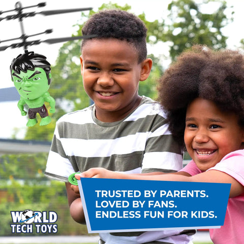 Children playing with Big Head Hulk Motion Sensing Flying UFO Helicopter Toy for Kids 6 Plus in an outdoor setting