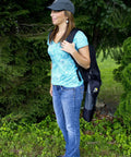 Person carrying Portable Folding Camping Stool With PackSeat Design Lightweight Yet Durable Ultra Compact Seat for outdoor events