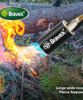 Weed Torch Kit With 10 Ft Hose High Output Propane Torch used on outdoor wood pile, showing blue flames and large nozzle in action.