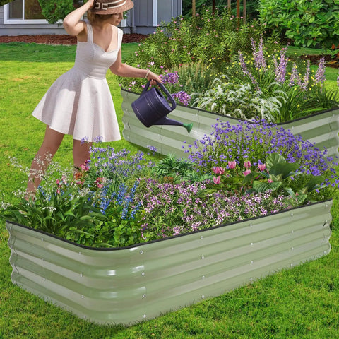 Woman watering plants in Galvanized Raised Garden Bed Kit 5X3X1 Modular Planter Box For Outdoor Gardening in backyard