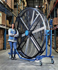 Hardcore 8 Foot Mobile Industrial Cooling Barrel Fan With Six Aluminum Blades And Variable Speed EC Motor in a warehouse.