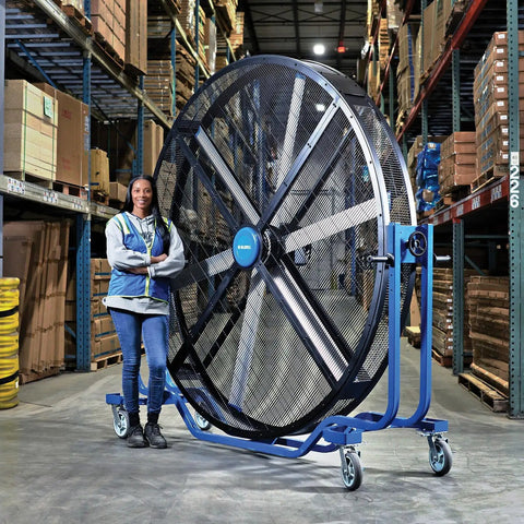 Hardcore 8 Foot Mobile Industrial Cooling Barrel Fan With Six Aluminum Blades And Variable Speed EC Motor in a warehouse.