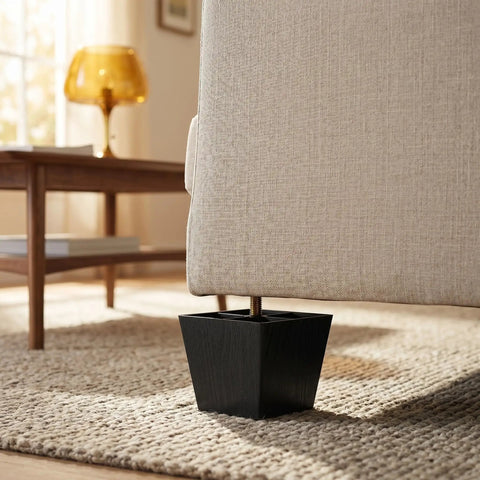 Close-up of 3-inch black square sofa leg with threaded post supporting beige sofa. Part of 8 Piece Adjustable Square Sofa Legs With Threaded Posts 3 Inch Height Adjustable Plastic And Metal Furniture Feet For Easy Upgrades Universal Compatibility For Chairs And Sofas In Living Room Bases.