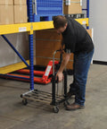 Person using Aluminum Platform Cart With 300 Lb Capacity 28 Inch Long Deck And 16 Inch Wide 9 Inch Overall Height in warehouse