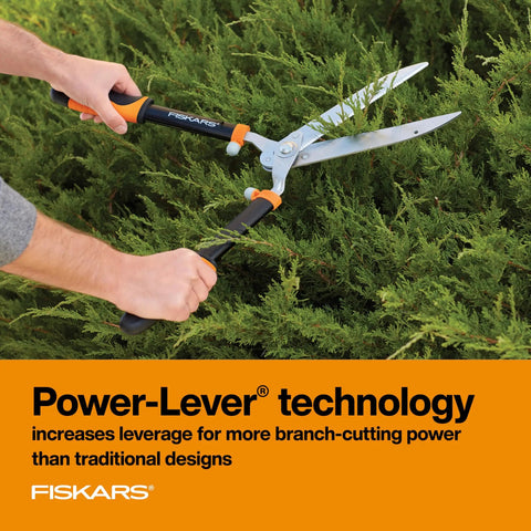 Power-Lever Hedge Shears 23-Inch With Self-Sharpening Blades For Thick Branches And Dense Hedges Lightweight 2.6 Pound Tool in use trimming evergreen hedge