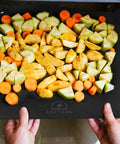 14x16 Inch Pizza Steel Pro Grade Heavy Duty Carbon Steel Baking Plate For Oven And Grill with vegetables placed on it in an oven
