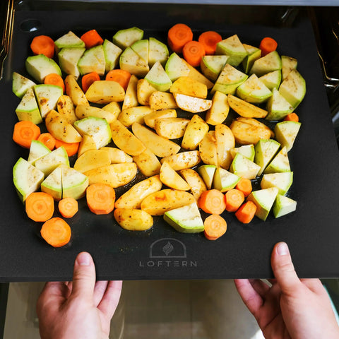 14x16 Inch Pizza Steel Pro Grade Heavy Duty Carbon Steel Baking Plate For Oven And Grill with vegetables placed on it in an oven
