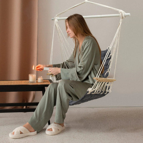 Woman relaxing in Chill Indoor Outdoor Hammock Chair With Wooden Armrests, Steel Spreader Bar And Anti Slip Rings, Cotton Weave Swing