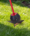 Magnetic Pickup Tool With 25lb Pull 27.5 Inch Reach Quick Release Handle on grass, showing red handle and black magnetic head