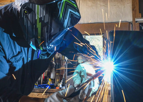 Welder using Copper MIG Contact Tips 0.030 Inch Pack Of 4 For Tweco Binzel Clarke Guns Pro Grade Machined for precise welds.